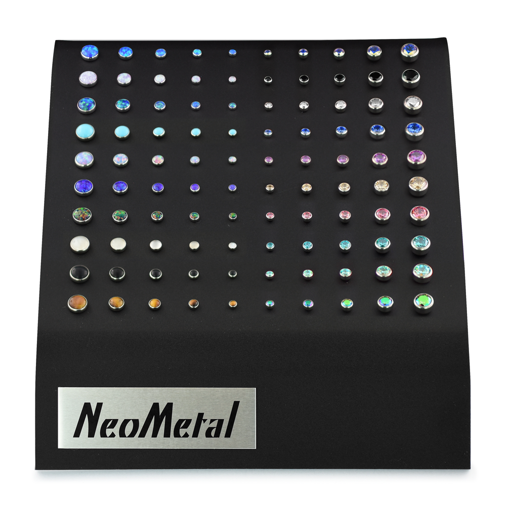 A 100 piece black acrylic display with a variety of sizes and cabochon colors for the Bezel Set Cabochon Ends and Bezel Set Faceted Gem Ends