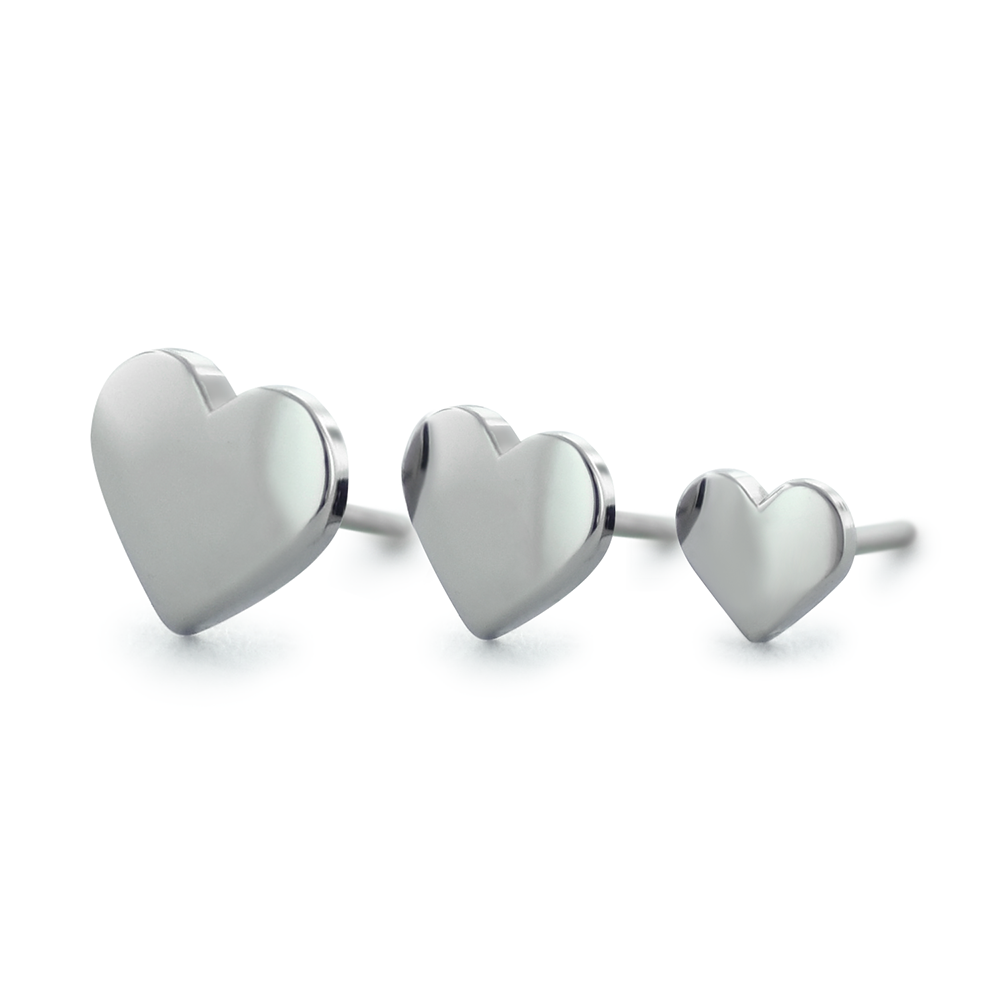 Three sizes of threadless titanium ends in the shape of hearts