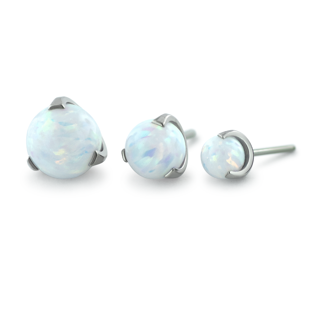 Three sizes of white opal sphere gems in a titanium claw setting