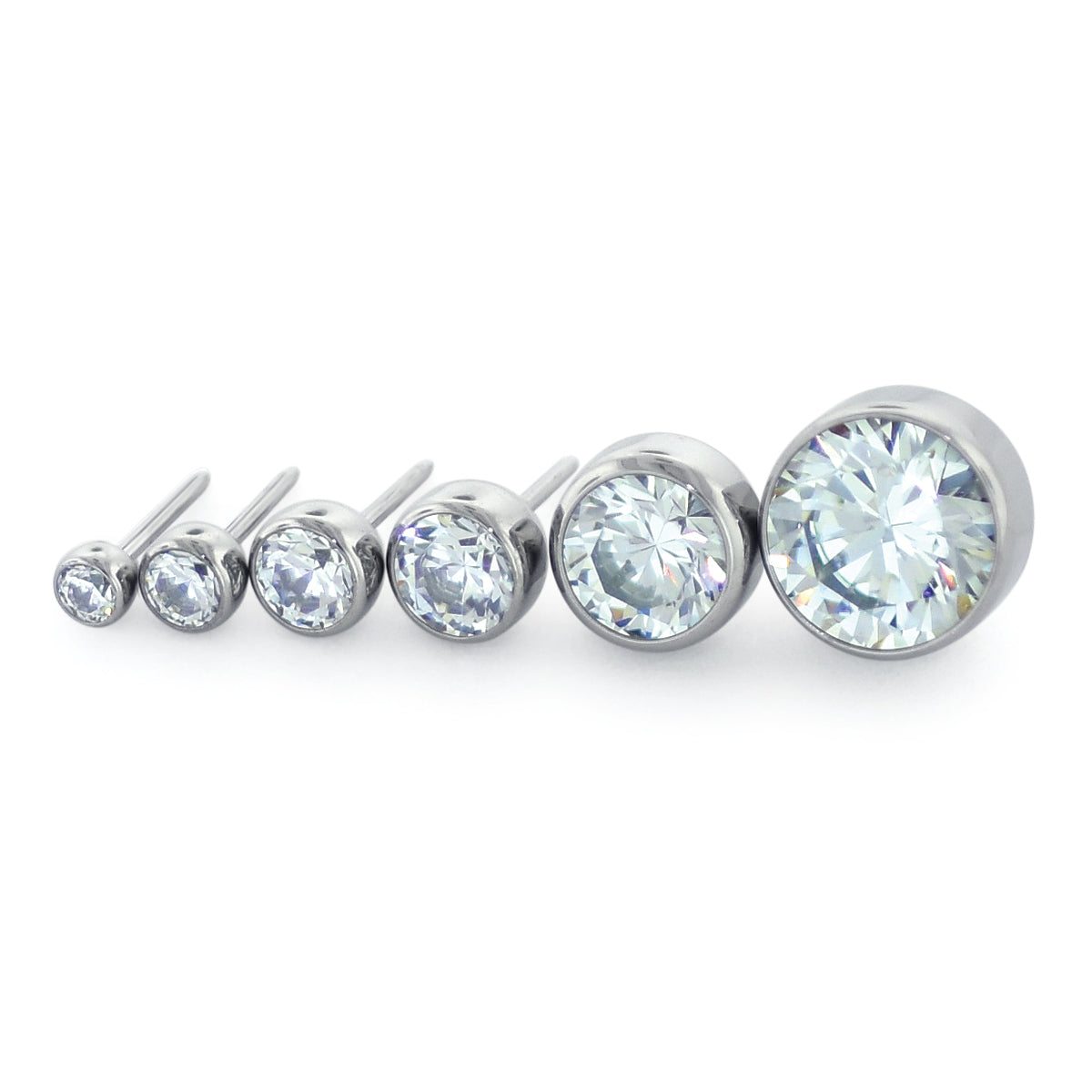 Six sizes of threadless titanium bezel set gem ends with cubic zirconia gems.